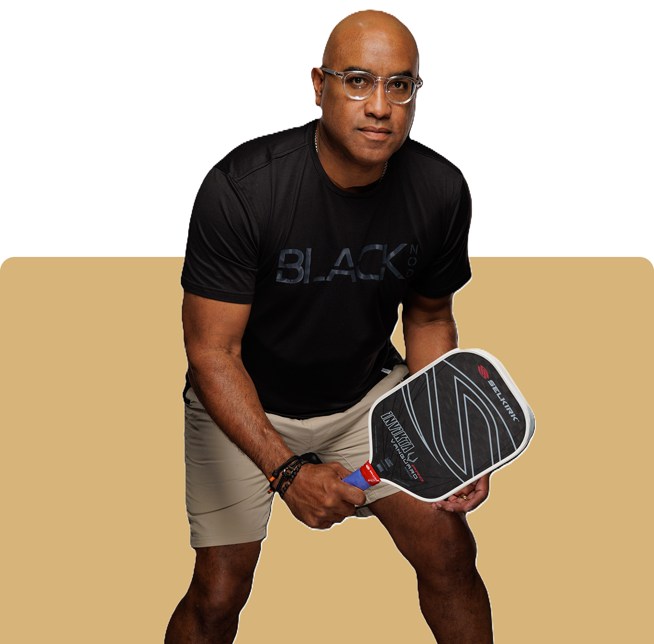 01 A man holding a racquet in his hands.